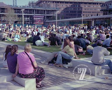 Peope watching the Games on a screen in Piccadilly Gardens