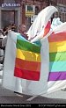 Man with rainbow flags, manchester Mardi Gras parade 2003
